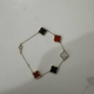 Elegant Gold and Red Clover Bracelet